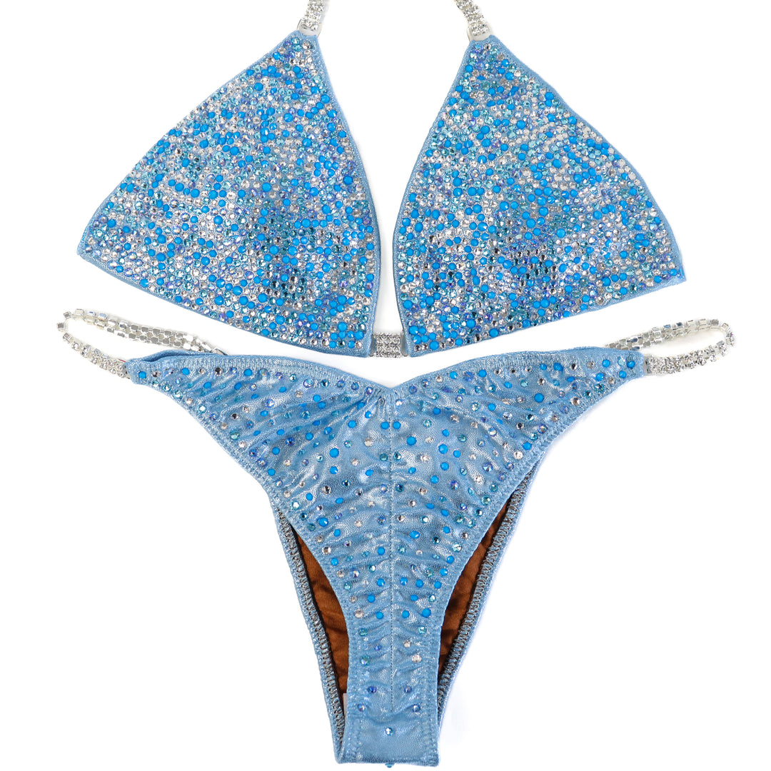 QS ST: Crystal Radiance. Hologram Baby Blue. Medium/Brazilian with Extra Modest Rise.  Angel Competition BikinisThe best NPC Competition Suits for the Bikini Division, Fit Model Division Suits, and bodybuilding suits.