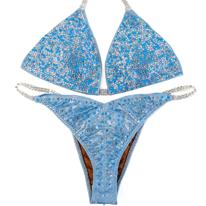 QS ST: Crystal Radiance. Hologram Baby Blue. Medium/Brazilian with Extra Modest Rise.  Angel Competition BikinisThe best NPC Competition Suits for the Bikini Division, Fit Model Division Suits, and bodybuilding suits.