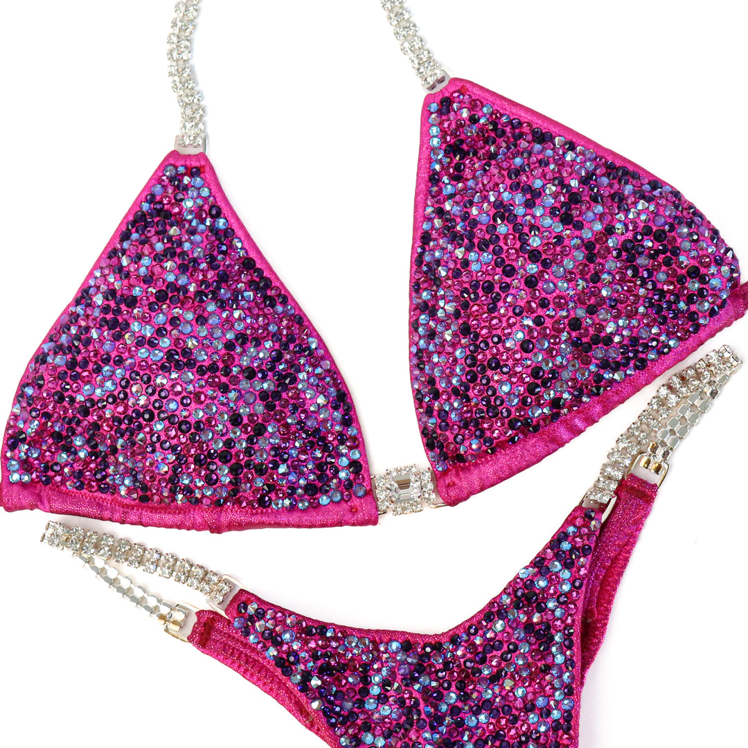 Pre Owned: Dustee's Pink Radiance. Small/Pro.  Angel Competition BikinisThe best NPC Competition Suits for the Bikini Division, Fit Model Division Suits, and bodybuilding suits.