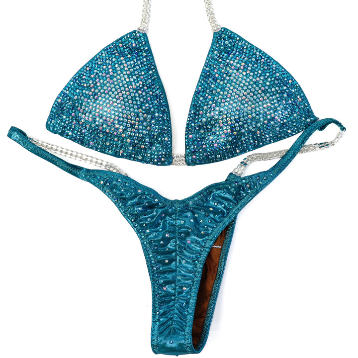 QS ST: Teal Nova. Medium/Pro with Modest Rise.  Angel Competition BikinisThe best NPC Competition Suits for the Bikini Division, Fit Model Division Suits, and bodybuilding suits.