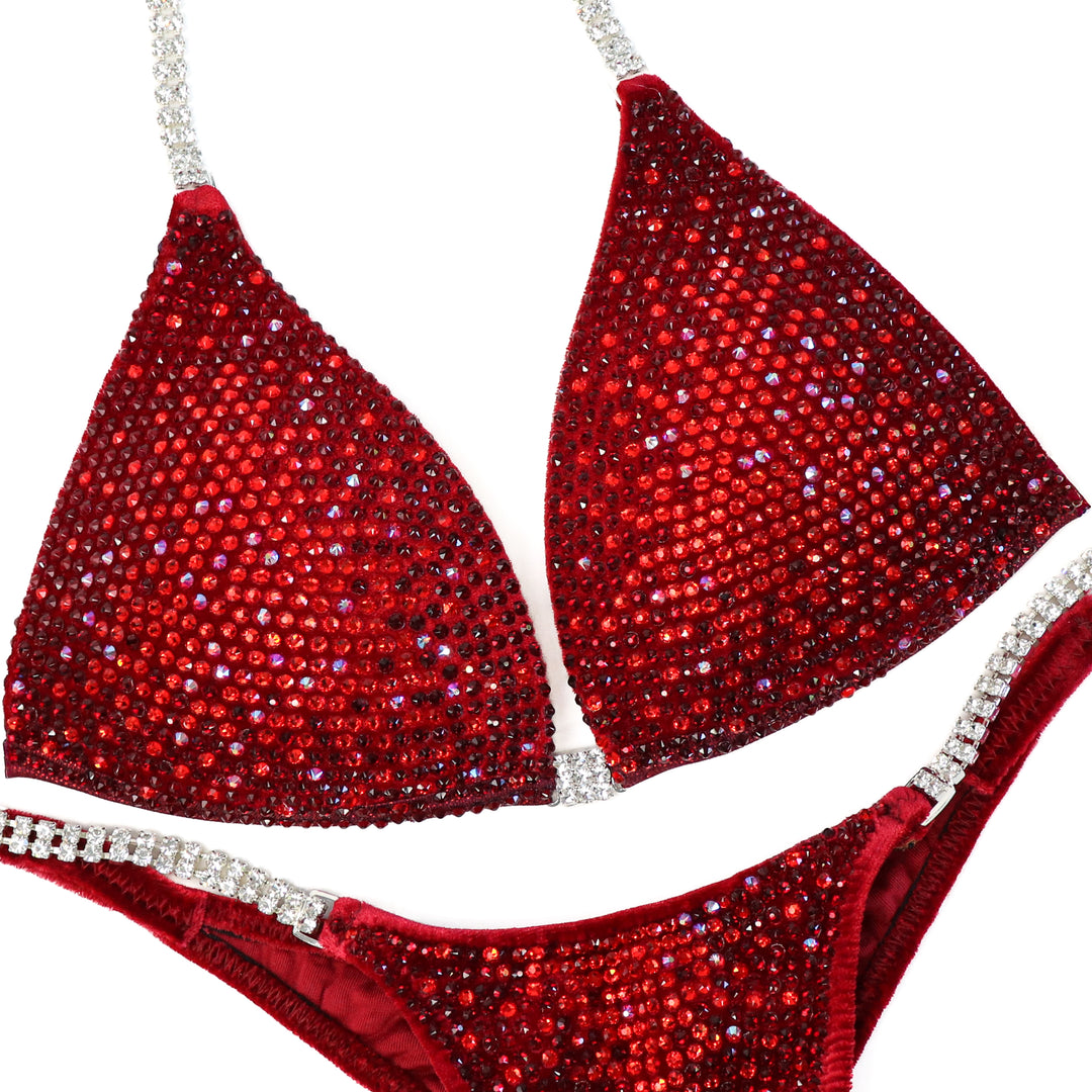 Red bikini set with sparkling details on a white background