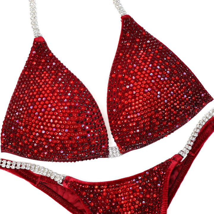 Red bikini set with sparkling details on a white background