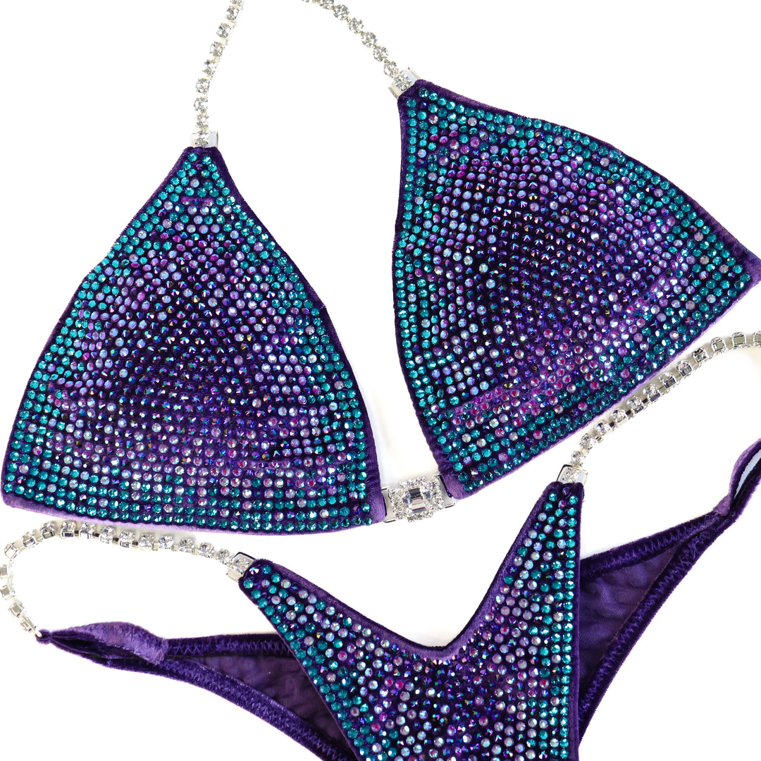 QS ST: Crystal Nova 3 Color. Velvet Purple. Medium/Pro with Modest Rise.  Angel Competition BikinisThe best NPC Competition Suits for the Bikini Division, Fit Model Division Suits, and bodybuilding suits.