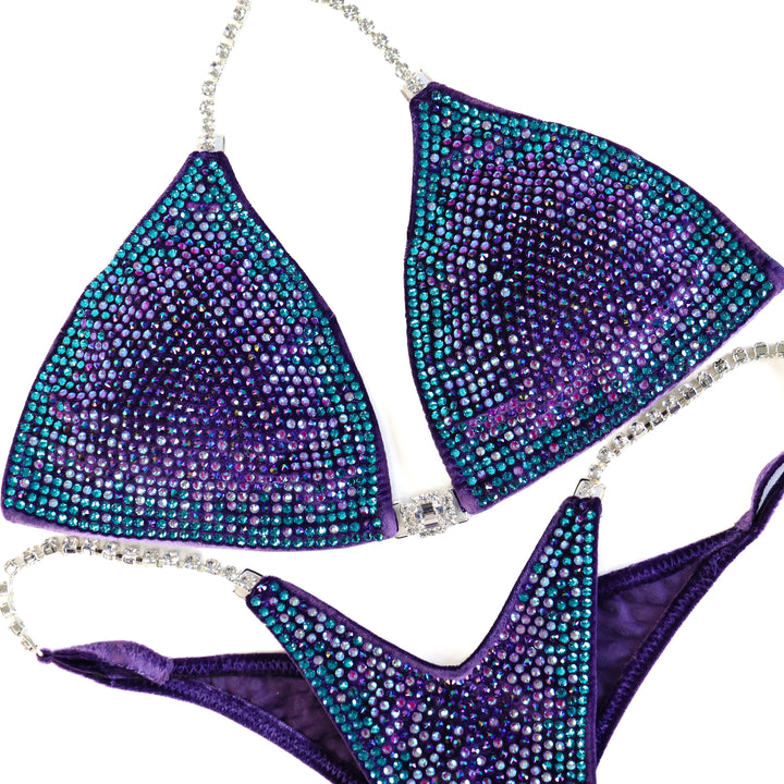 QS ST: Crystal Nova 3 Color. Velvet Purple. Medium/Pro with Modest Rise.  Angel Competition BikinisThe best NPC Competition Suits for the Bikini Division, Fit Model Division Suits, and bodybuilding suits.
