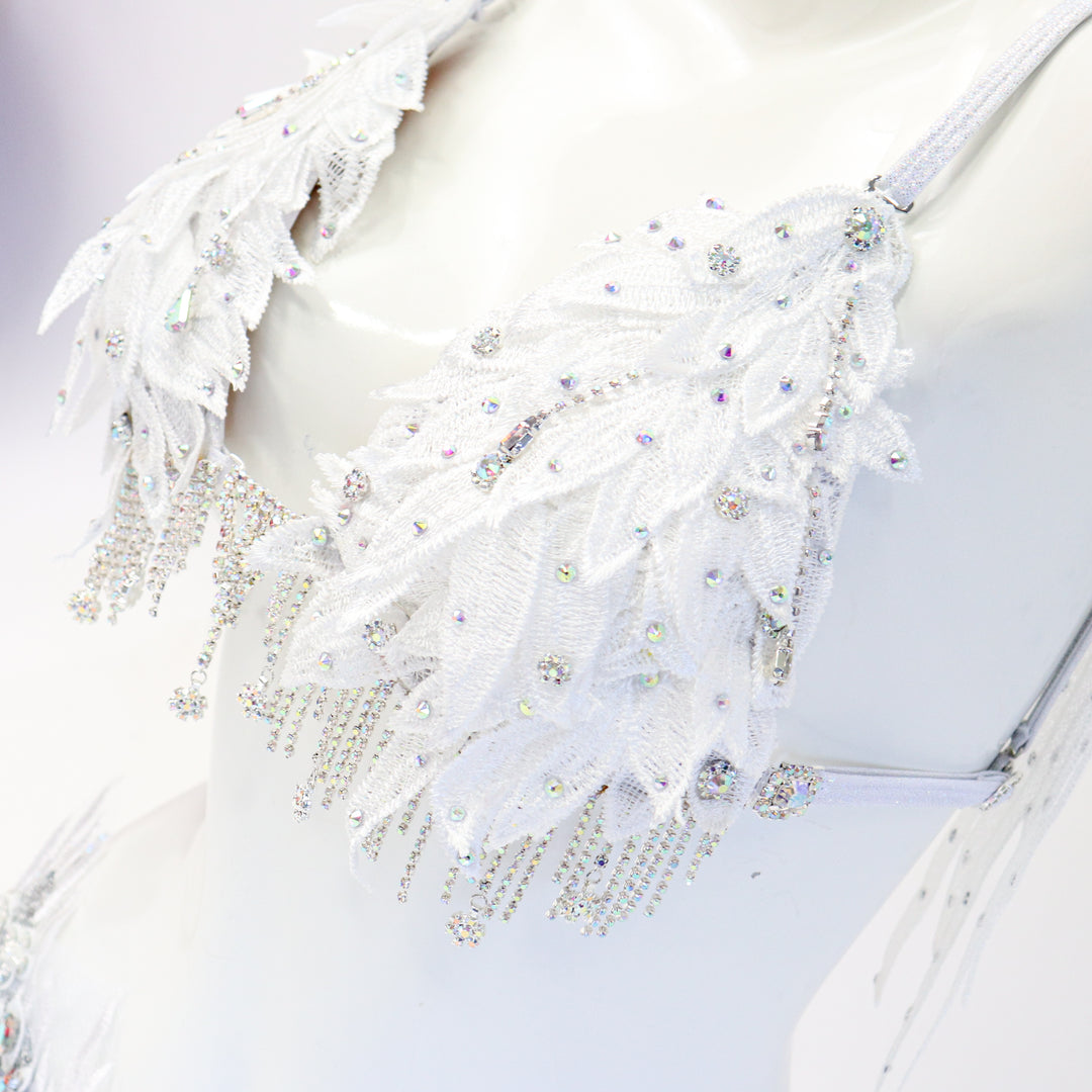 White couture bikini on a mannequin against a white background