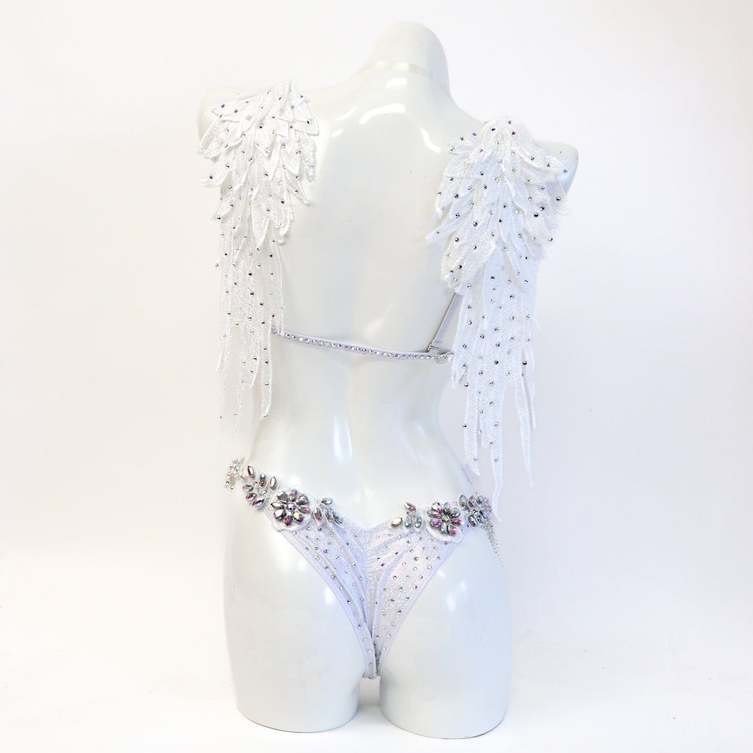 White couture bikini on a mannequin against a white background