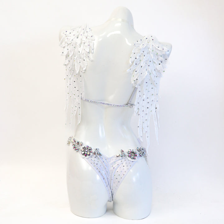 White couture bikini on a mannequin against a white background