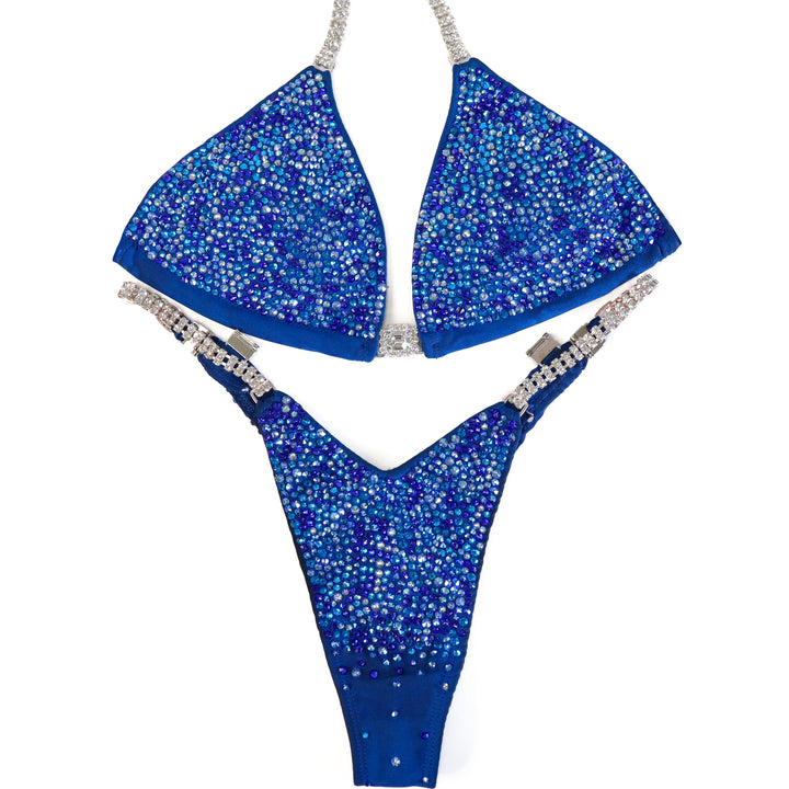 Pre Owned: Matte Blue Radiance. Medium/Slim Figure.  Angel Competition BikinisThe best NPC Competition Suits for the Bikini Division, Fit Model Division Suits, and bodybuilding suits.