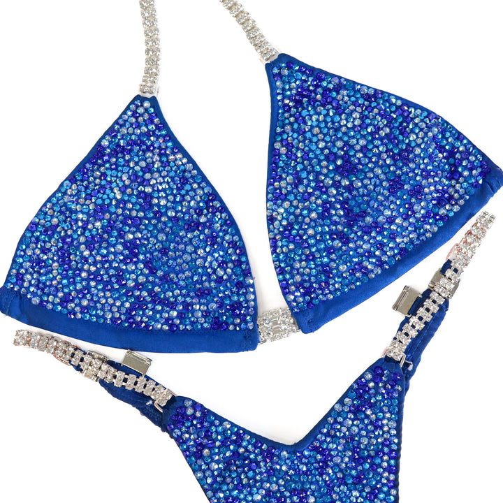 Pre Owned: Matte Blue Radiance. Medium/Slim Figure.  Angel Competition BikinisThe best NPC Competition Suits for the Bikini Division, Fit Model Division Suits, and bodybuilding suits.