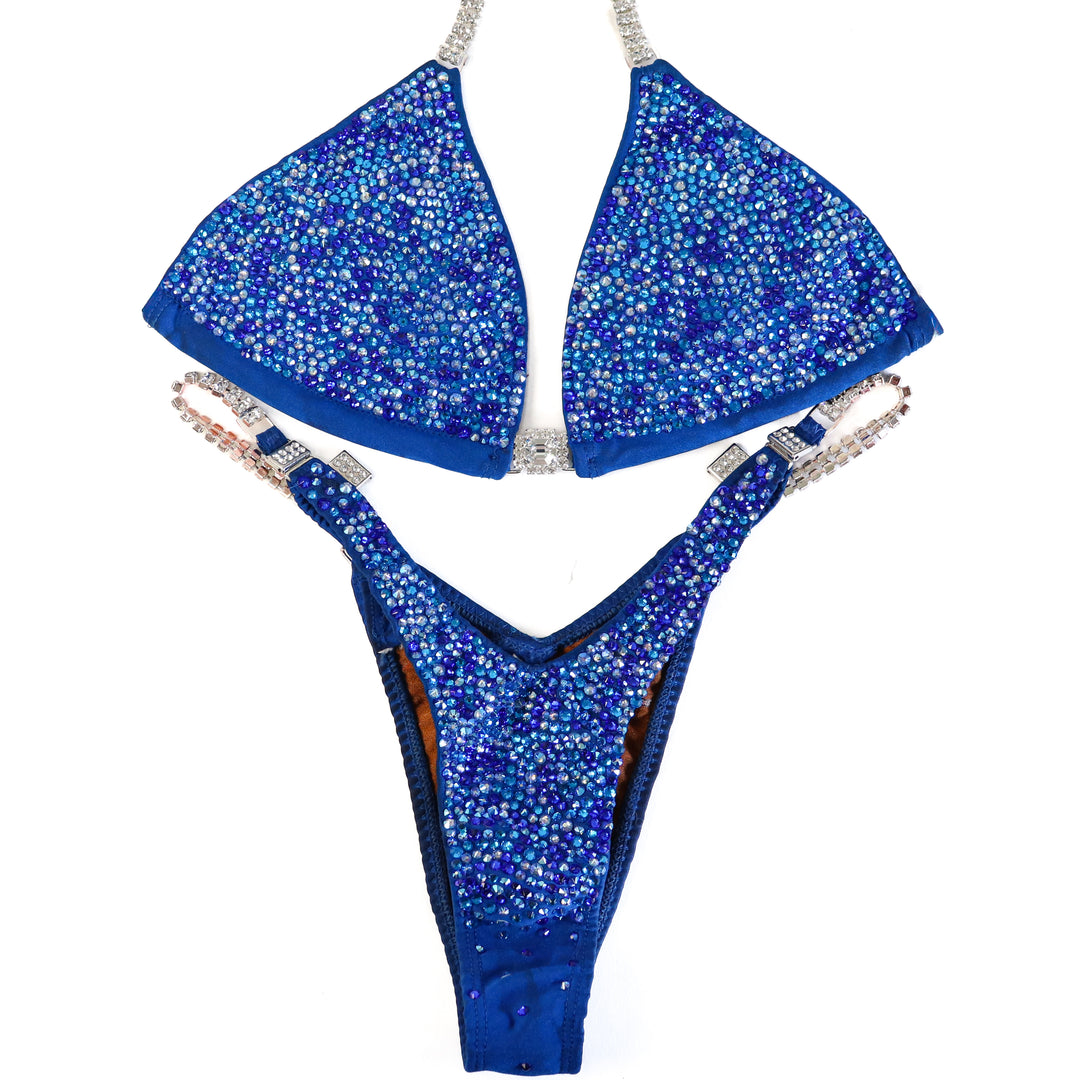 Pre Owned: Matte Blue Radiance. Medium/Slim Figure.  Angel Competition BikinisThe best NPC Competition Suits for the Bikini Division, Fit Model Division Suits, and bodybuilding suits.