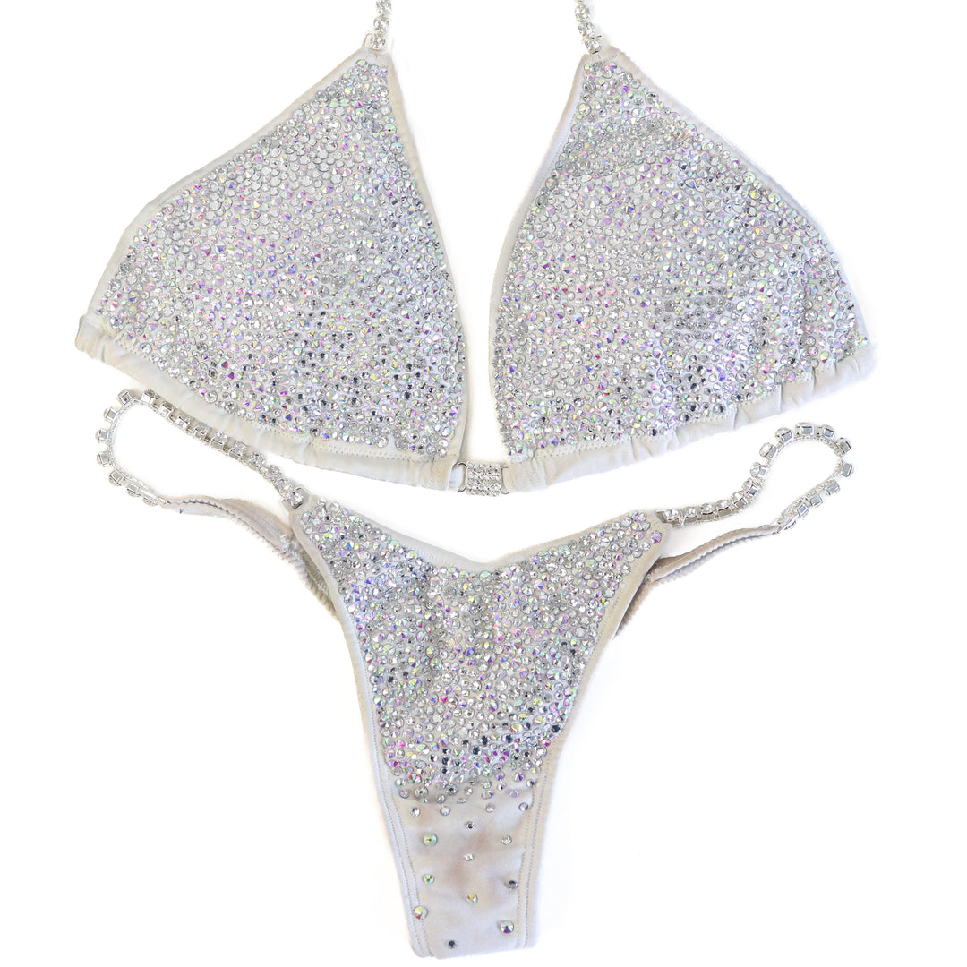 Pre Owned: White Goddess Radiance. Large/Micro with Petite Rise.  Angel Competition BikinisThe best NPC Competition Suits for the Bikini Division, Fit Model Division Suits, and bodybuilding suits.