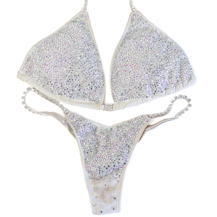 Pre Owned: White Goddess Radiance. Large/Micro with Petite Rise.  Angel Competition BikinisThe best NPC Competition Suits for the Bikini Division, Fit Model Division Suits, and bodybuilding suits.