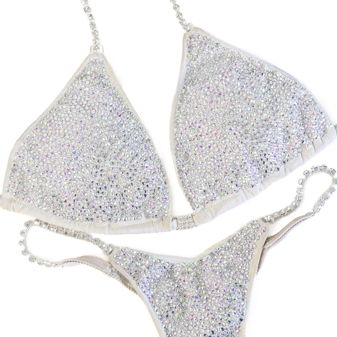 Pre Owned: White Goddess Radiance. Large/Micro with Petite Rise.  Angel Competition BikinisThe best NPC Competition Suits for the Bikini Division, Fit Model Division Suits, and bodybuilding suits.