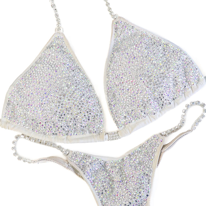 Pre Owned: White Goddess Radiance. Large/Micro with Petite Rise.  Angel Competition BikinisThe best NPC Competition Suits for the Bikini Division, Fit Model Division Suits, and bodybuilding suits.