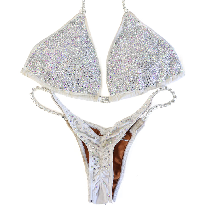 Pre Owned: White Goddess Radiance. Large/Micro with Petite Rise.  Angel Competition BikinisThe best NPC Competition Suits for the Bikini Division, Fit Model Division Suits, and bodybuilding suits.