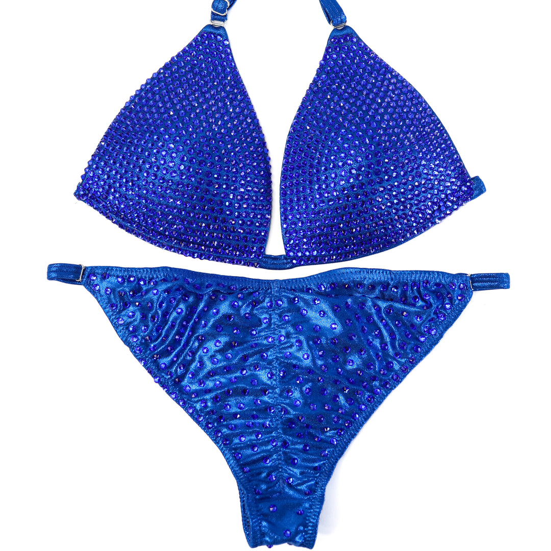 QS ST: Crystallized Hologram Electric Blue Fit Model Suit. Medium Molded/Fit Model 2.  Angel Competition BikinisThe best NPC Competition Suits for the Bikini Division, Fit Model Division Suits, and bodybuilding suits.