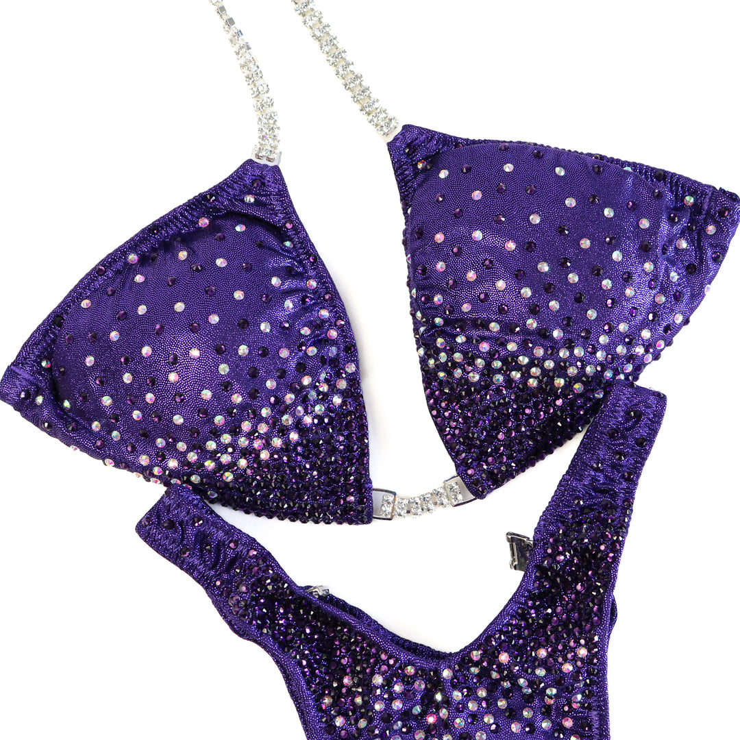 QS ST: Angel Firework. Hologram Eggplant. Medium/Standard Figure.  Angel Competition BikinisThe best NPC Competition Suits for the Bikini Division, Fit Model Division Suits, and bodybuilding suits.