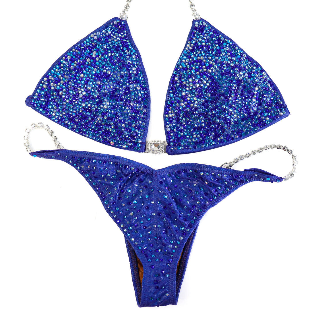 QS ST: Crystal Radiance. Hologram Electric Purple. Large/Pro with Modest Rise.  Angel Competition BikinisThe best NPC Competition Suits for the Bikini Division, Fit Model Division Suits, and bodybuilding suits.