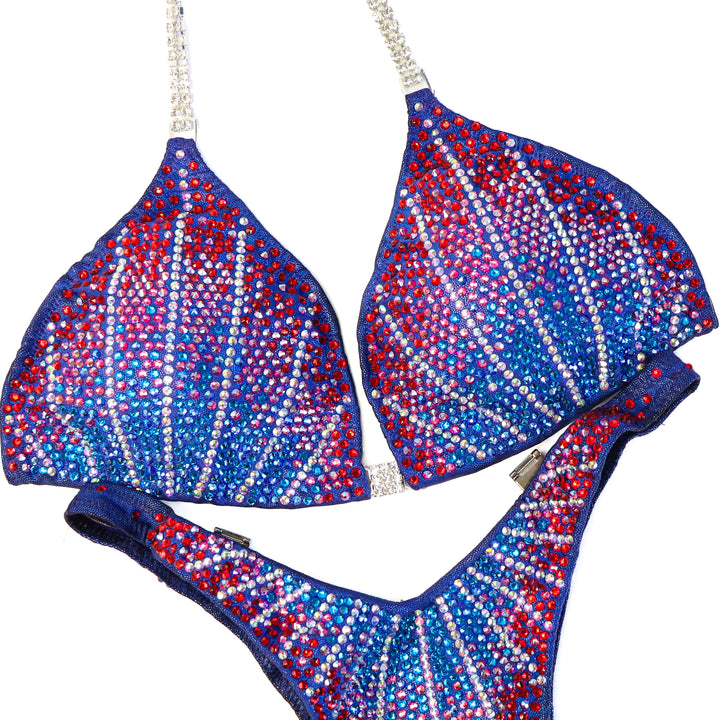 Pre Owned: Crystal Cosmo. Hologram Electric Purple. Medium/Standard Figure.  Angel Competition BikinisThe best NPC Competition Suits for the Bikini Division, Fit Model Division Suits, and bodybuilding suits.