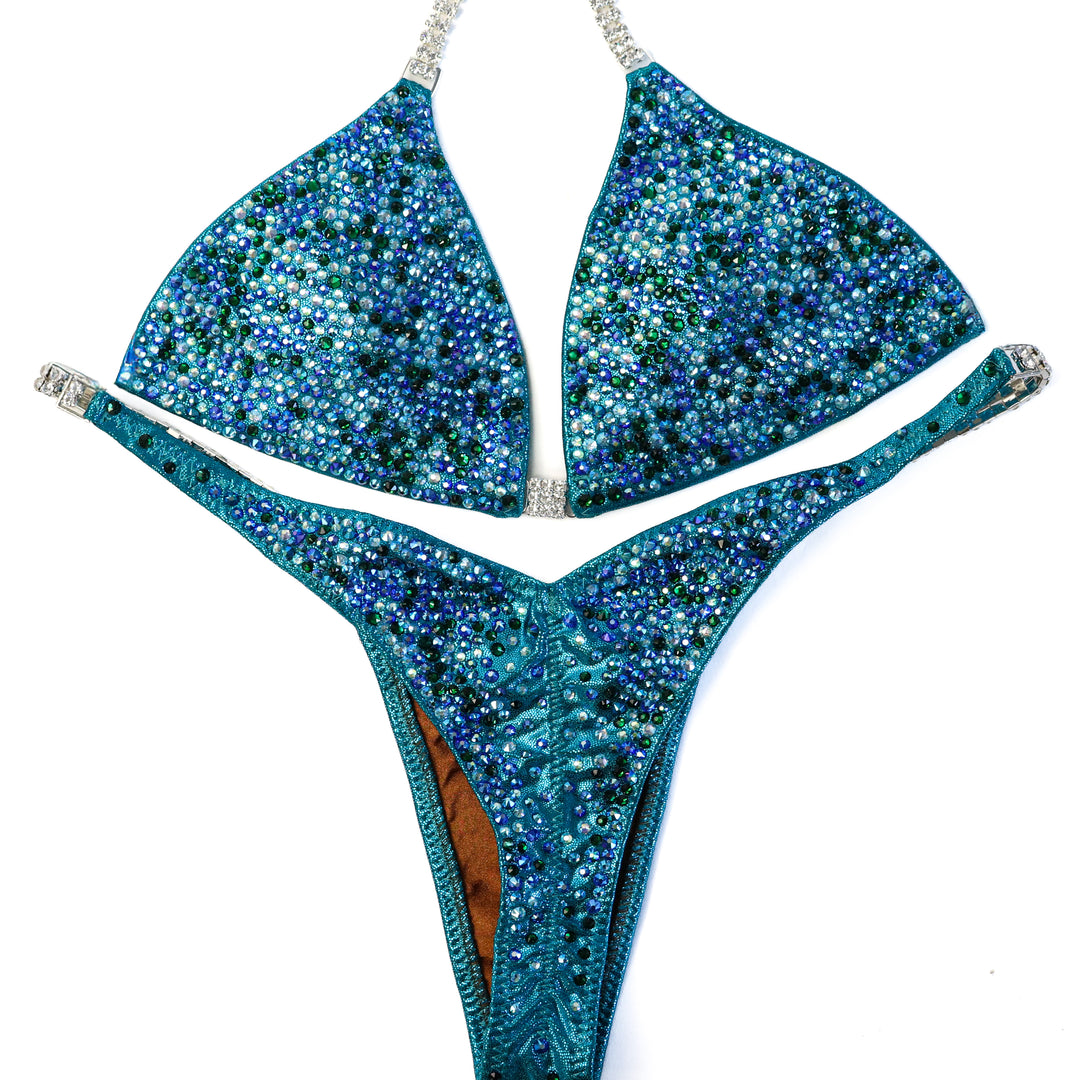 QS ST: Triumphant Teal Radiance. Small/Pro  Angel Competition BikinisThe best NPC Competition Suits for the Bikini Division, Fit Model Division Suits, and bodybuilding suits.