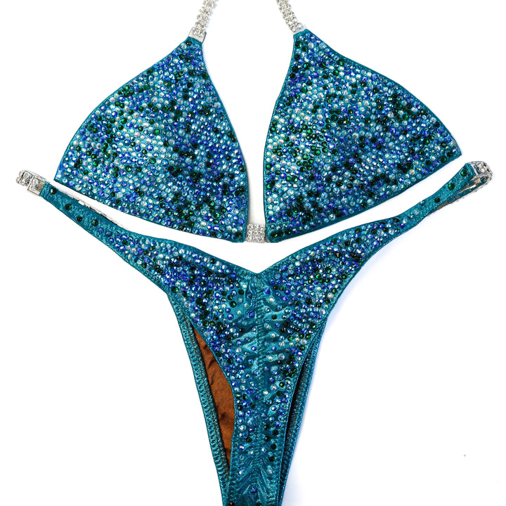QS ST: Triumphant Teal Radiance. Small/Pro  Angel Competition BikinisThe best NPC Competition Suits for the Bikini Division, Fit Model Division Suits, and bodybuilding suits.