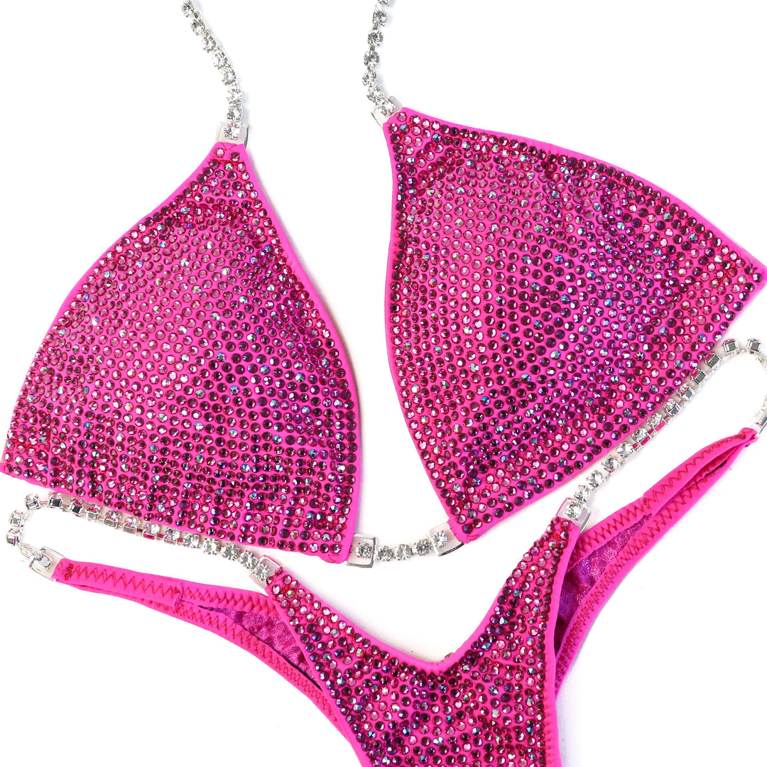QS CL: Angel Shimmer. Matte Pink. Medium/Wellness Micro.  Angel Competition BikinisThe best NPC Competition Suits for the Bikini Division, Fit Model Division Suits, and bodybuilding suits.
