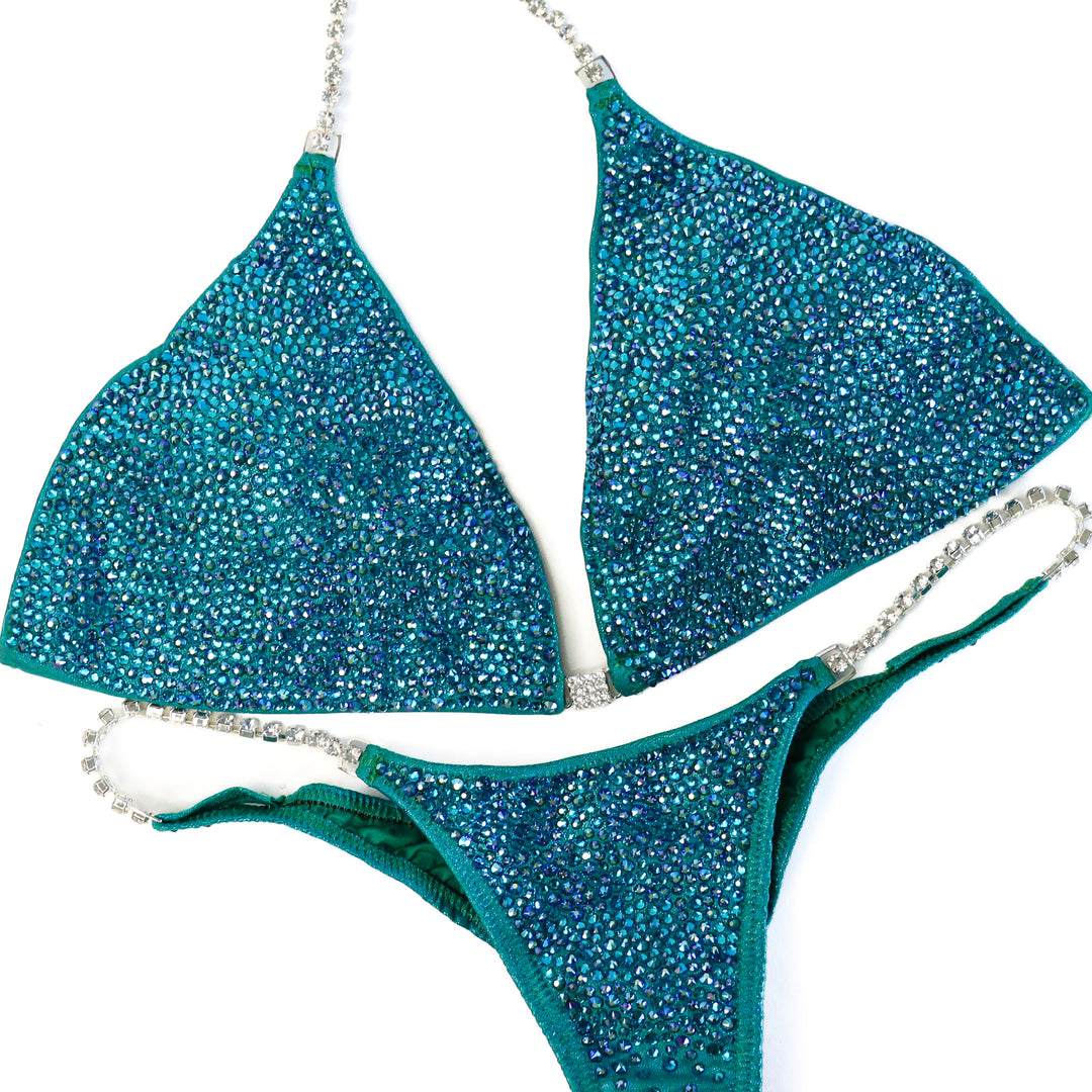 QS ST: Casey's Blue Zircon Radiance. Extra Large/Pro.  Angel Competition BikinisThe best NPC Competition Suits for the Bikini Division, Fit Model Division Suits, and bodybuilding suits.