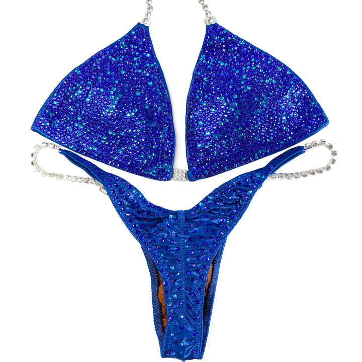 QS ST: Dazzlebolt Blue Radiance. Medium/Wellness Pro.  Angel Competition BikinisThe best NPC Competition Suits for the Bikini Division, Fit Model Division Suits, and bodybuilding suits.