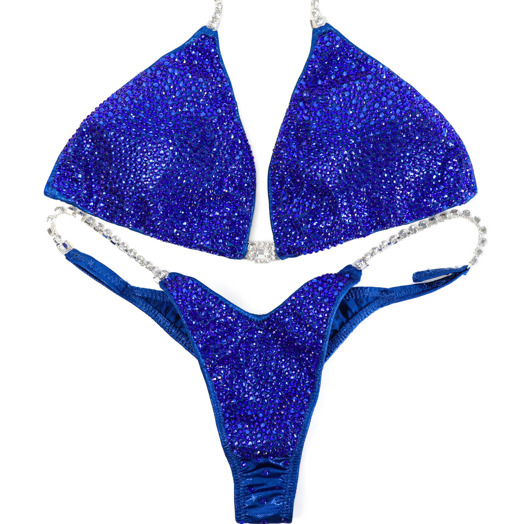 QS ST: True Blue Radiance. Large/Pro with Modest Rise.  Angel Competition BikinisThe best NPC Competition Suits for the Bikini Division, Fit Model Division Suits, and bodybuilding suits.