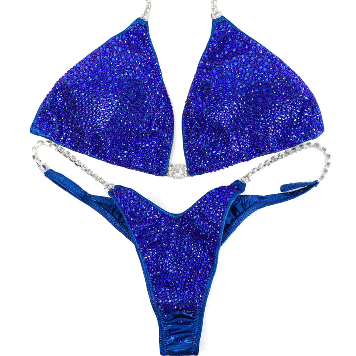 QS ST: True Blue Radiance. Large/Pro with Modest Rise.  Angel Competition BikinisThe best NPC Competition Suits for the Bikini Division, Fit Model Division Suits, and bodybuilding suits.