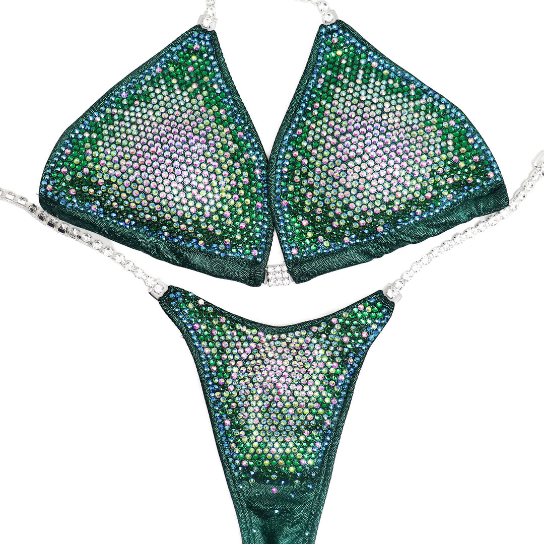 Nina's Emerald Nova Competition Suit, tailored for NPC Bikini or Wellness Competitors. Dazzle on stage with its beautifully radiant green hue, exuding elegance and confidence. Elevate your performance, shine like a star, and make every moment count.