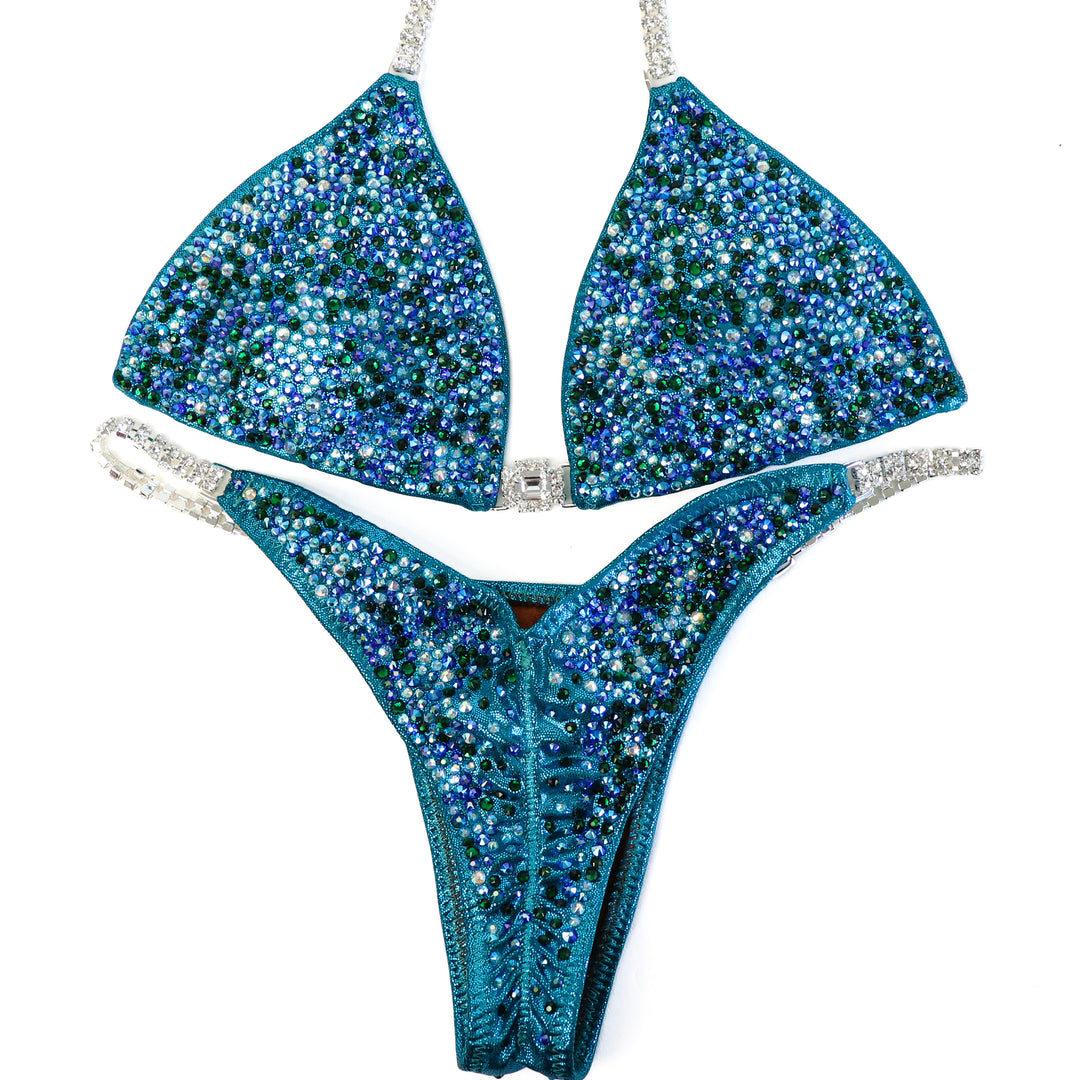 QS ST: Triumphant Teal Radiance. Small/Pro  Angel Competition BikinisThe best NPC Competition Suits for the Bikini Division, Fit Model Division Suits, and bodybuilding suits.