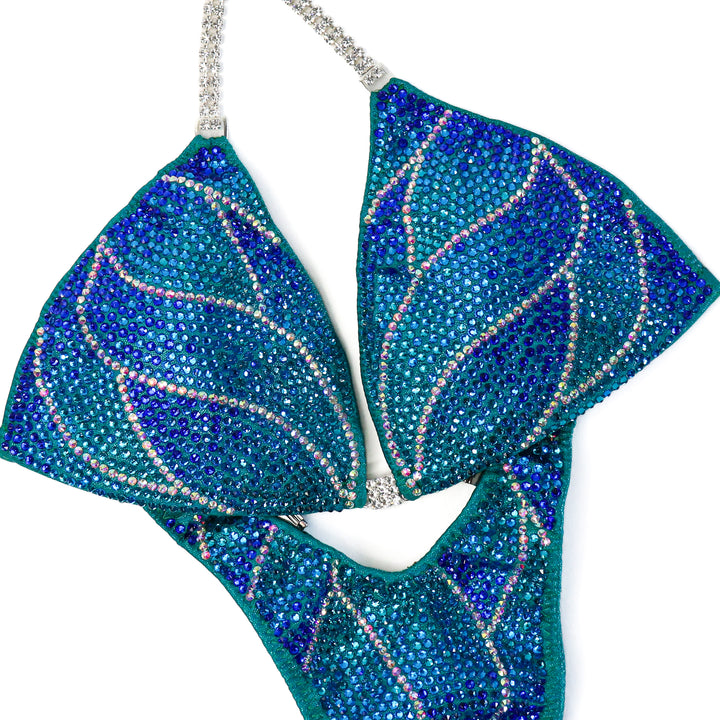 QS CL: Crystal Nebula. Hologram Electric Green. Medium/Standard Figure.  Angel Competition BikinisThe best NPC Competition Suits for the Bikini Division, Fit Model Division Suits, and bodybuilding suits.