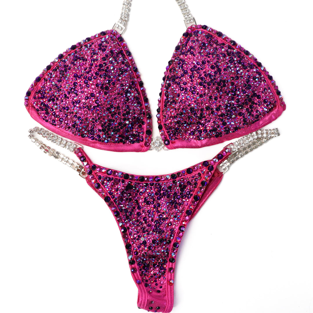 Pre Owned: Fuchsia Fantasy Radiance. Small/Olympian Cut.  Angel Competition BikinisThe best NPC Competition Suits for the Bikini Division, Fit Model Division Suits, and bodybuilding suits.