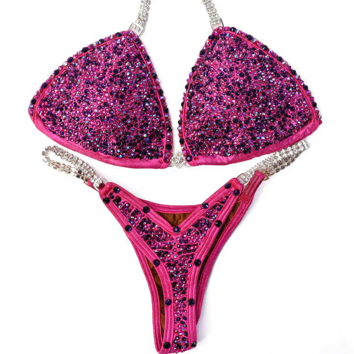 Pre Owned: Fuchsia Fantasy Radiance. Small/Olympian Cut.  Angel Competition BikinisThe best NPC Competition Suits for the Bikini Division, Fit Model Division Suits, and bodybuilding suits.