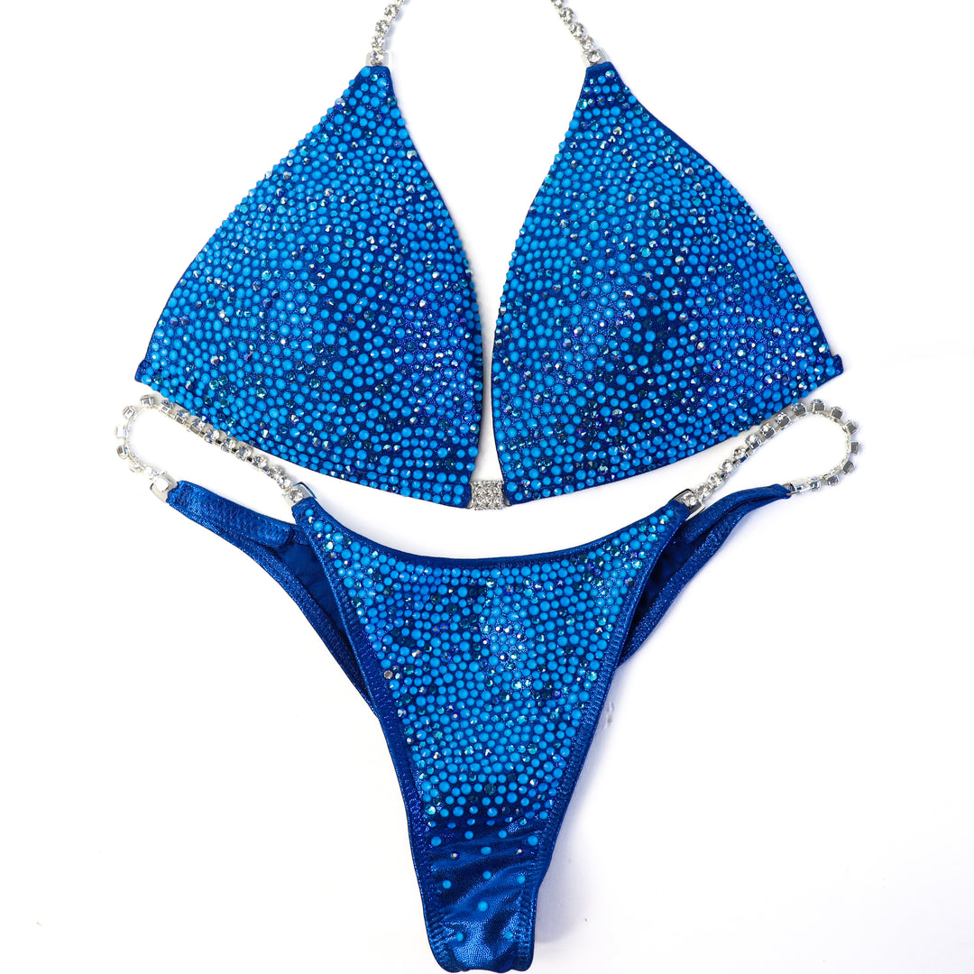 QS ST:  Blue Lagoon Radiance. Large/Pro, Modest Rise.  Angel Competition BikinisThe best NPC Competition Suits for the Bikini Division, Fit Model Division Suits, and bodybuilding suits.