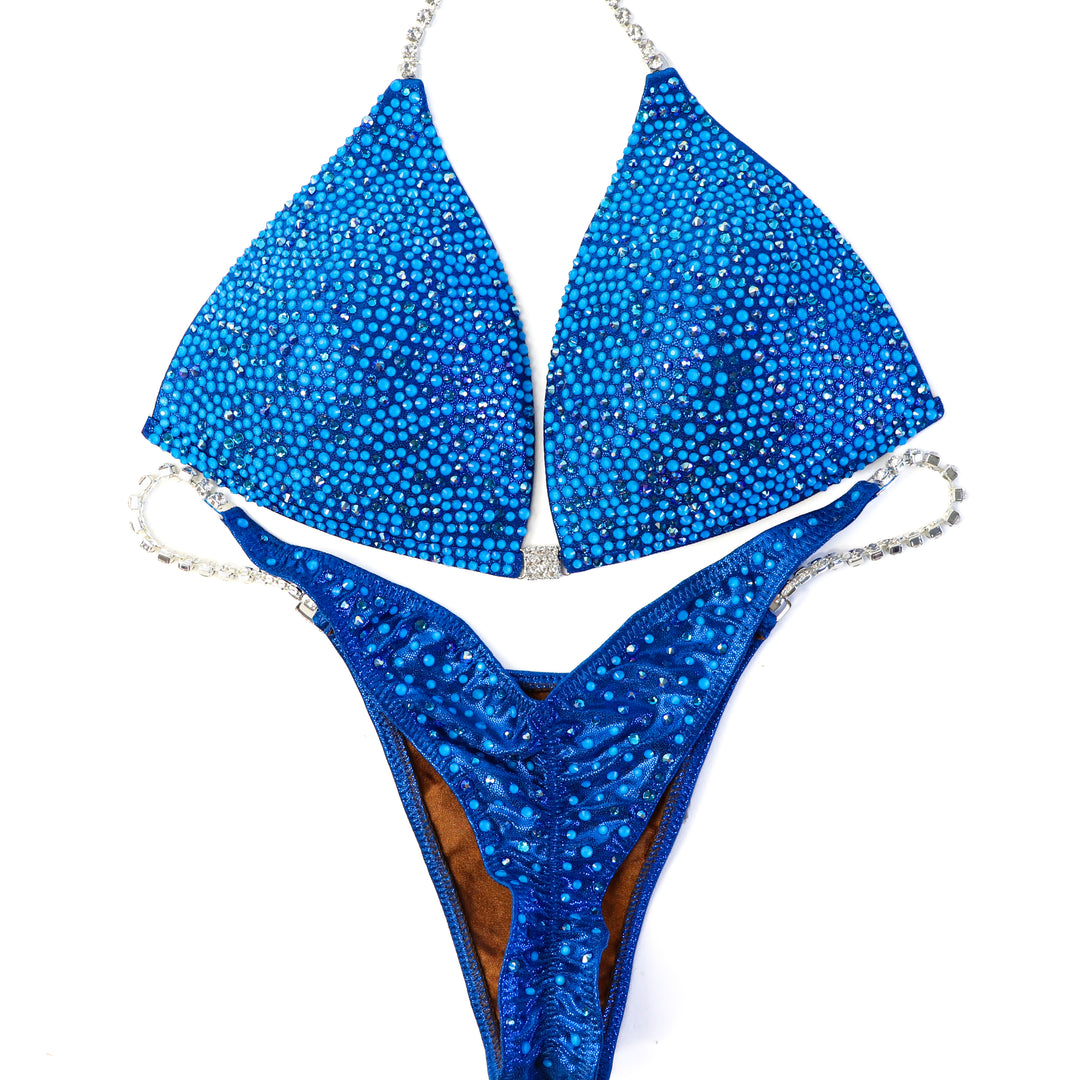 QS ST:  Blue Lagoon Radiance. Large/Pro, Modest Rise.  Angel Competition BikinisThe best NPC Competition Suits for the Bikini Division, Fit Model Division Suits, and bodybuilding suits.