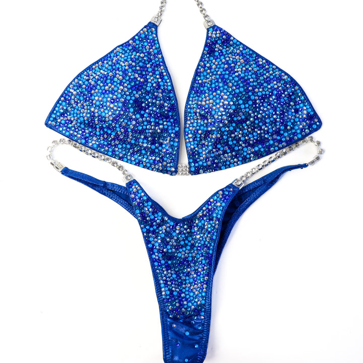 QS ST: Neon Blue Horizon Radiance. Medium/Wellness Micro.  Angel Competition BikinisThe best NPC Competition Suits for the Bikini Division, Fit Model Division Suits, and bodybuilding suits.