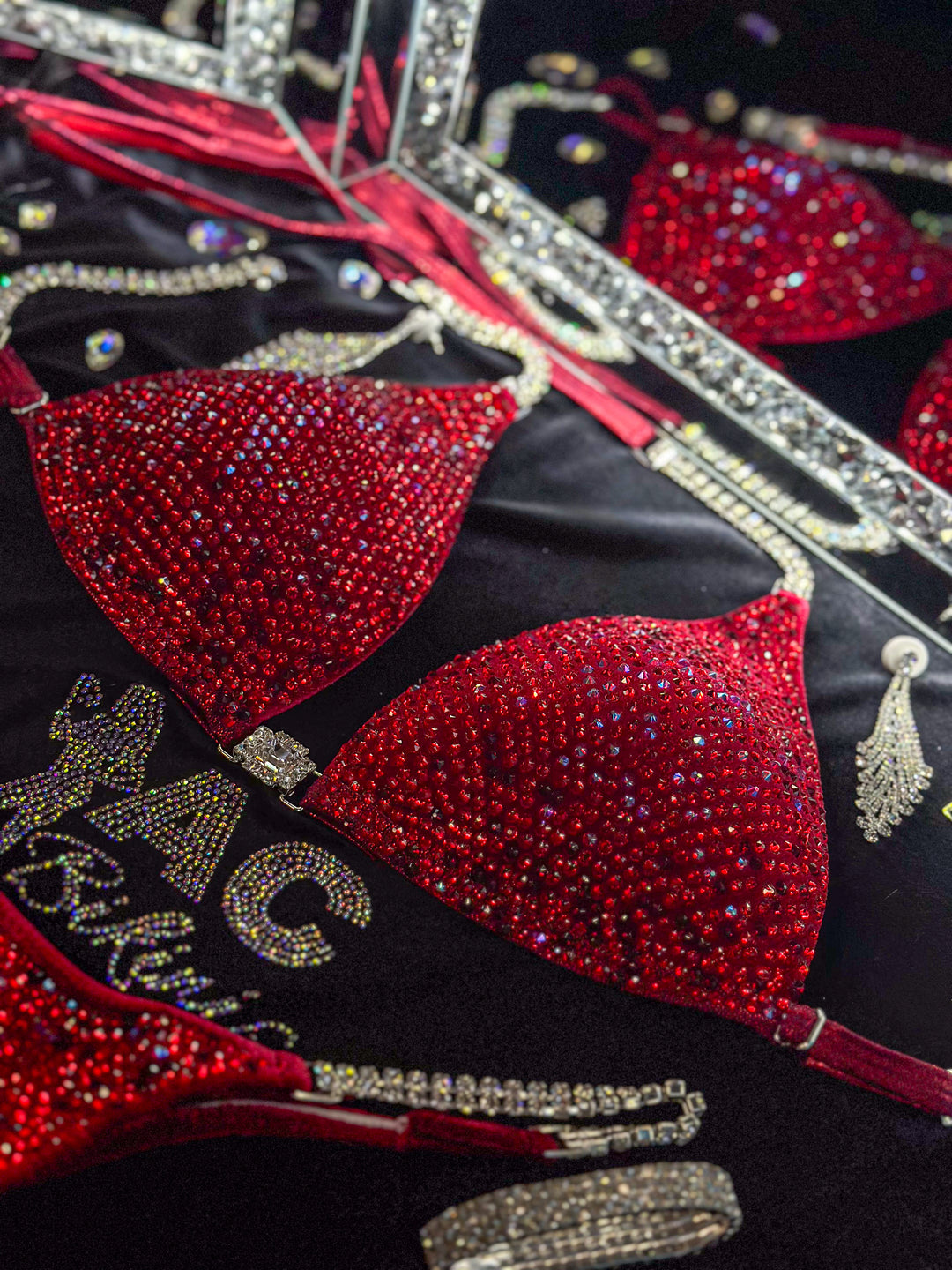 Julia Renee's Leave Him on Red Nova  Angel Competition BikinisThe best NPC Competition Suits for the Bikini Division, Fit Model Division Suits, and bodybuilding suits.
