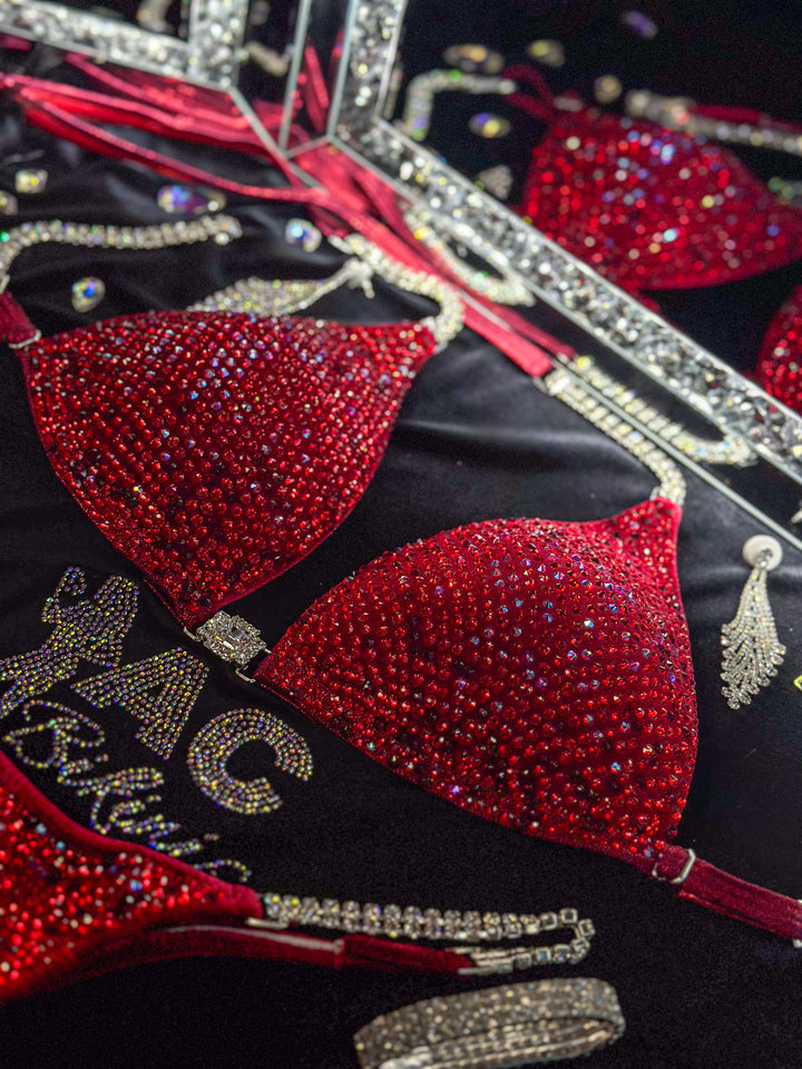 Julia Renee's Leave Him on Red Nova  Angel Competition BikinisThe best NPC Competition Suits for the Bikini Division, Fit Model Division Suits, and bodybuilding suits.