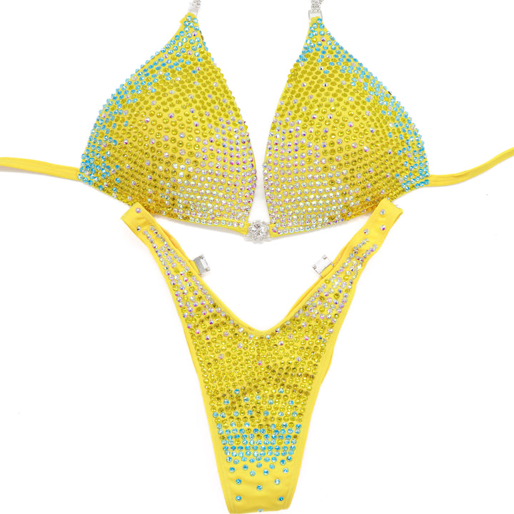Shine bright in the **Sunny Splash Trinity**—a bold hologram yellow suit with Crystal AB, Sunflower, and Aqua AB crystals for ultimate stage sparkle.