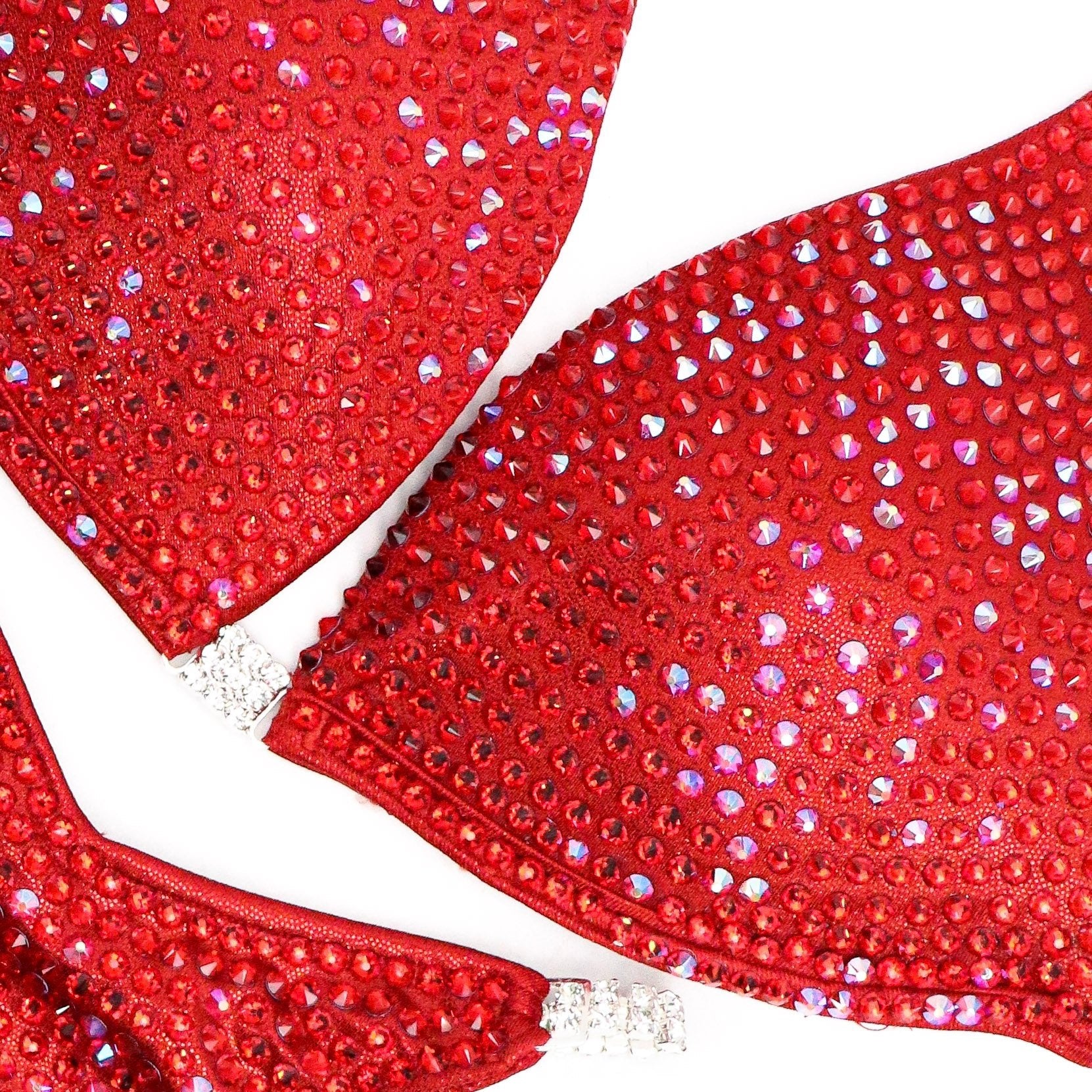 Introducing Ashley K's Cherry Bomb Trinity, inspired by Ashley Kaltwasser's iconic suit at the 2023 Denver Mile High. Radiating with vibrant red hues, this suit ensures you command attention on stage. Elevate your performance with its striking design, a must-have for serious competitors.