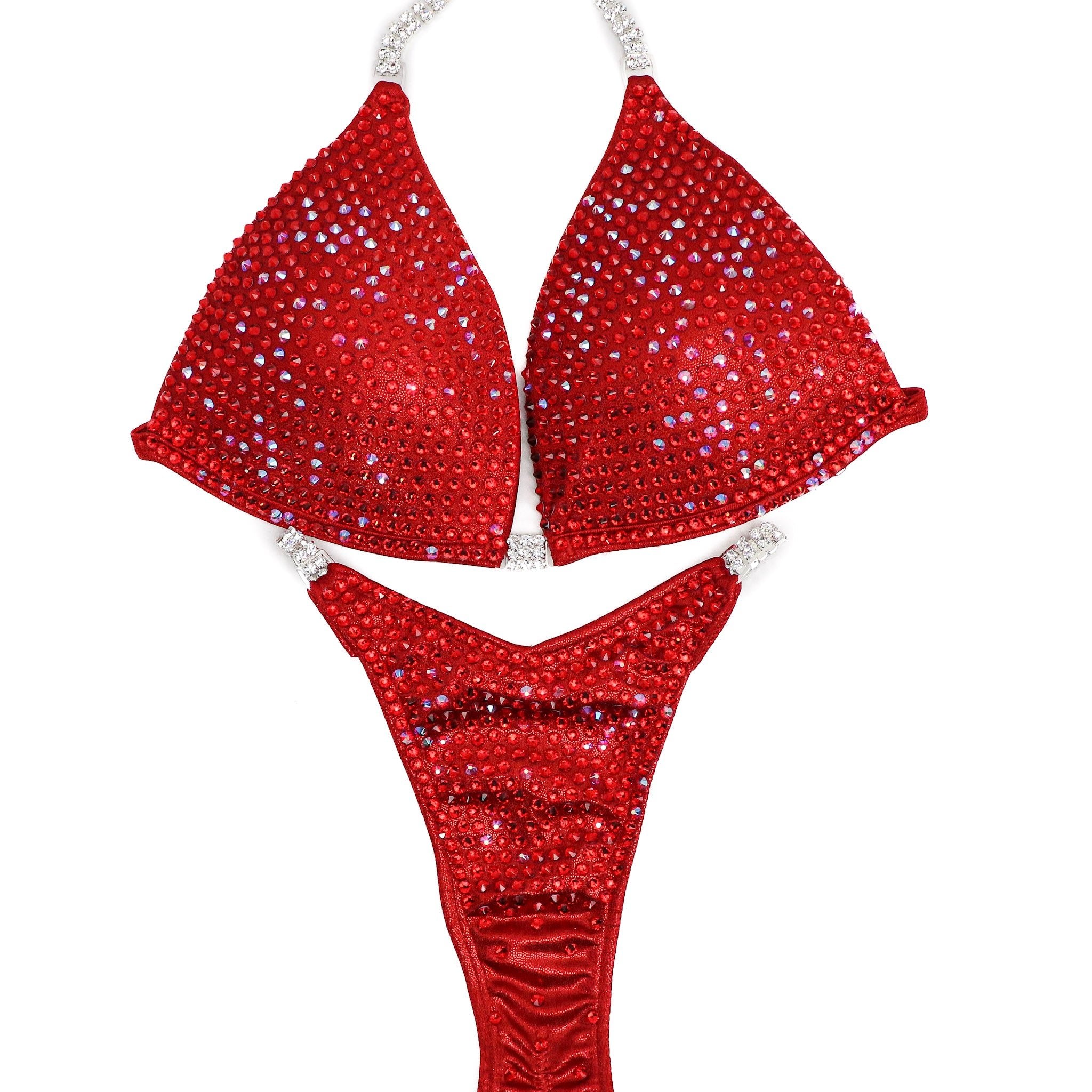 Introducing Ashley K's Cherry Bomb Trinity, inspired by Ashley Kaltwasser's iconic suit at the 2023 Denver Mile High. Radiating with vibrant red hues, this suit ensures you command attention on stage. Elevate your performance with its striking design, a must-have for serious competitors.