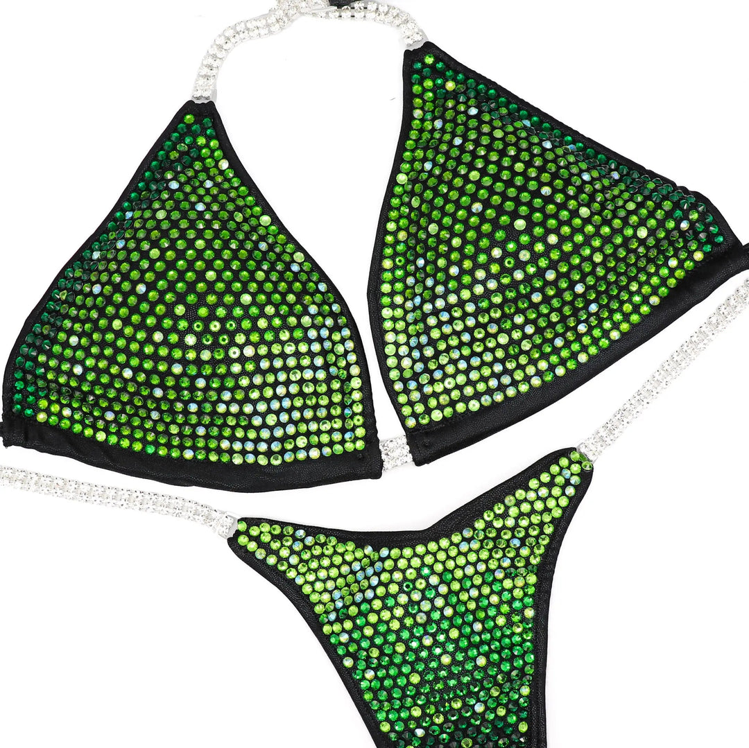 Black bikini set adorned with green gradient crystal rhinestones and sparkling silver straps for athletes.