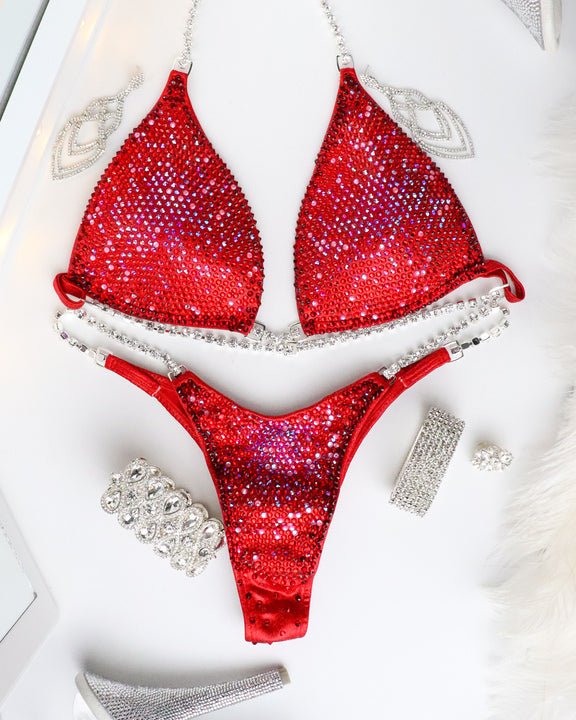 Introducing Deb's Strawberry Shortcake Nova: the perfect blend of strength and femininity. This red suit, kissed with pink hues, elevates confidence and enhances your stage presence. Shine brighter with Deb's signature style! 💪🍓 #FemaleBodybuilding #ConfidenceBoost