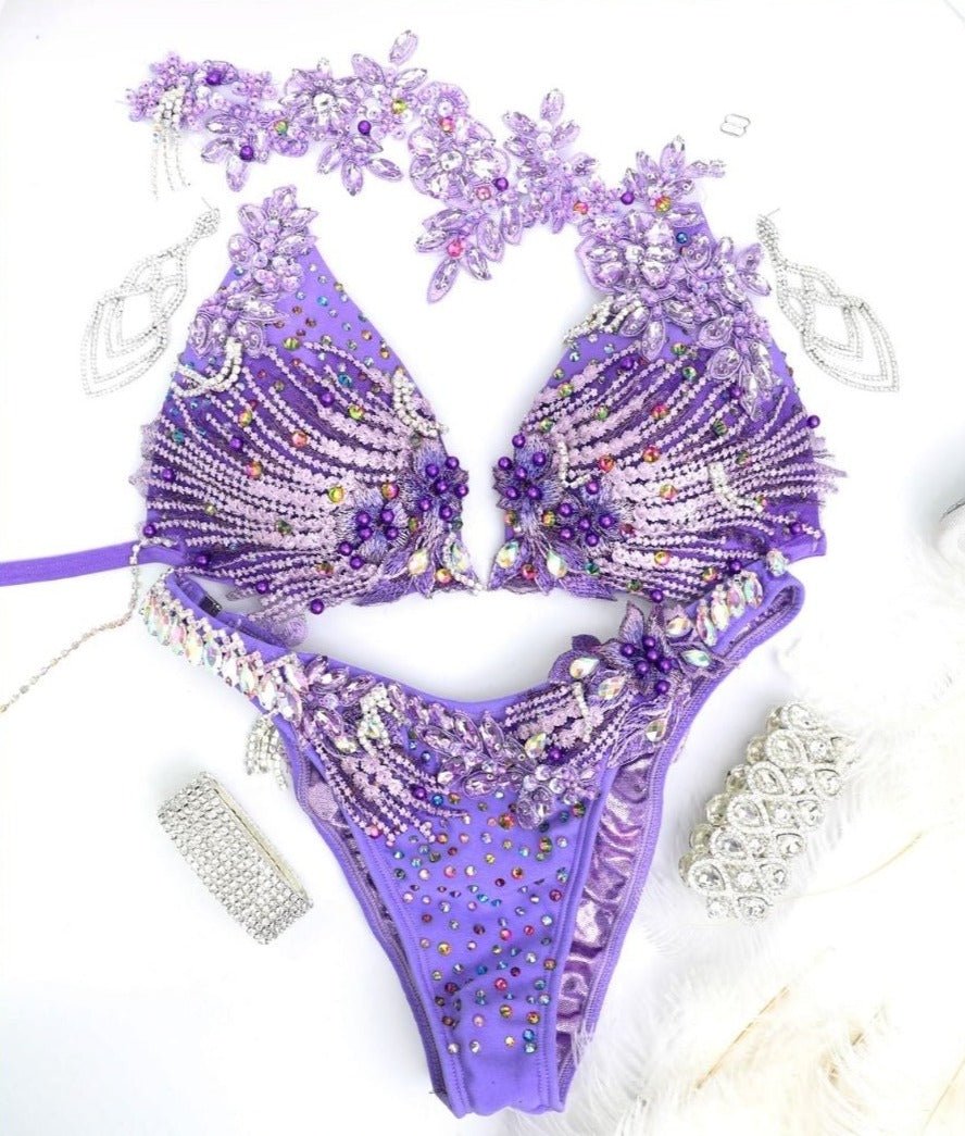 Discover stunning FMG competition bikinis designed to make you shine on stage. Our high-quality, custom-fit bikinis offer exquisite detailing and vibrant colors to ensure you stand out in your next FMG competition.