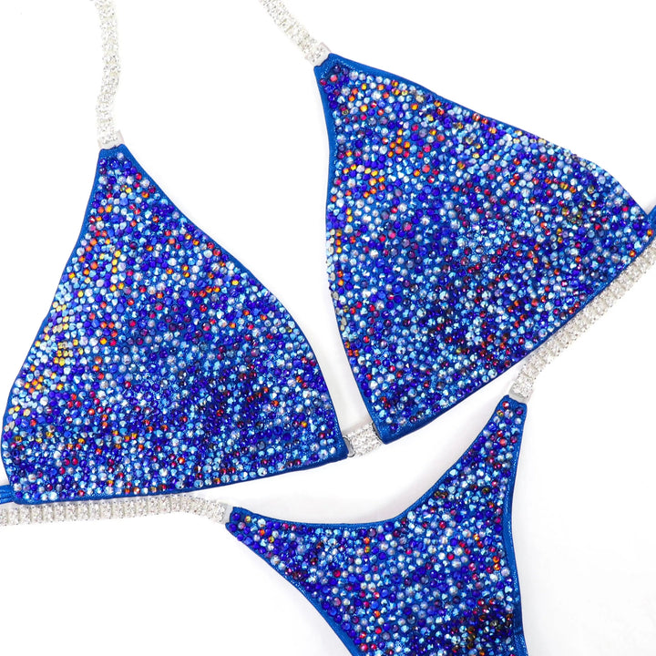 Electric Blue Volcano Radiance: A vibrant blue competition suit with a sprinkle of volcano crystals for an explosive stage presence! 🌋💙 #Bodybuilding 
