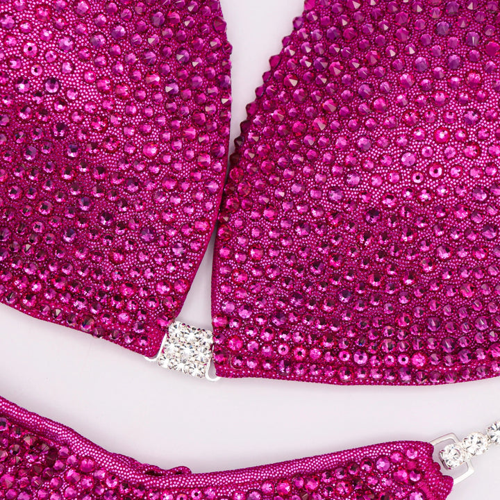 Glow on stage in the Fuchsia Radiance suit! A stunning Hologram Mulberry with a bold Fuchsia shine. ✨💖 #Bodybuilding #CompetitionSuit #Fuchsia #Hologram #MuscleGoals
