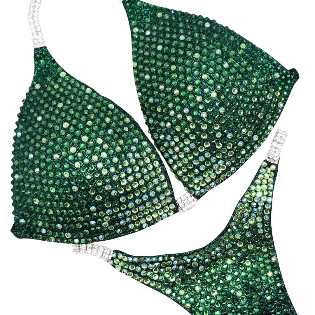 Green custom bikini set embellished with gradient crystal diamonds designed for athletes and figure competitors.