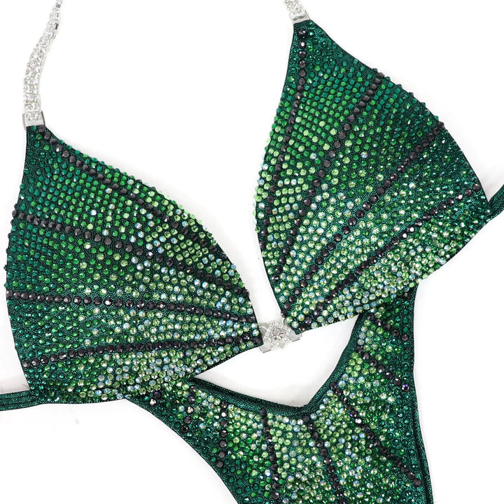 Stand out in the **Green Galaxy** suit! Stunning emerald green with bold green crystals for a powerful, fierce look. ✨💚 #Bodybuilding #CompetitionSuit #GreenGalaxy #BoldAndBeautiful